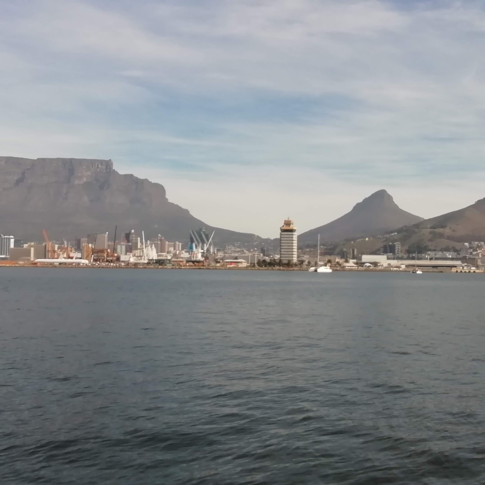 Table Mountain and Lion's Head rising above the Cape Town city skyline and harbour
